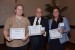 Dr. Nagib Callaos, General Chair, giving Dr. Bridget Moore and Dr. Jennifer Styron the best paper award certificate of the session "Social Applications and Systems." The title of the awarded paper is "Modeling Evidence-Based Application: Using Team-Based Learning to Increase Higher Order Thinking in Nursing Research."